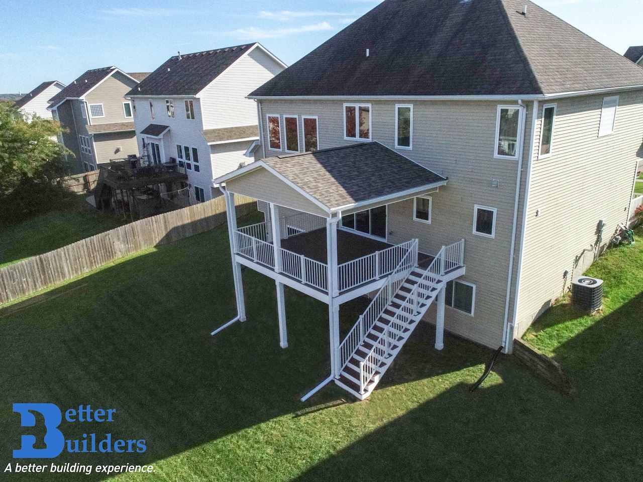 Covered deck with Trex decking, PVC facia and columns, and Trex railing